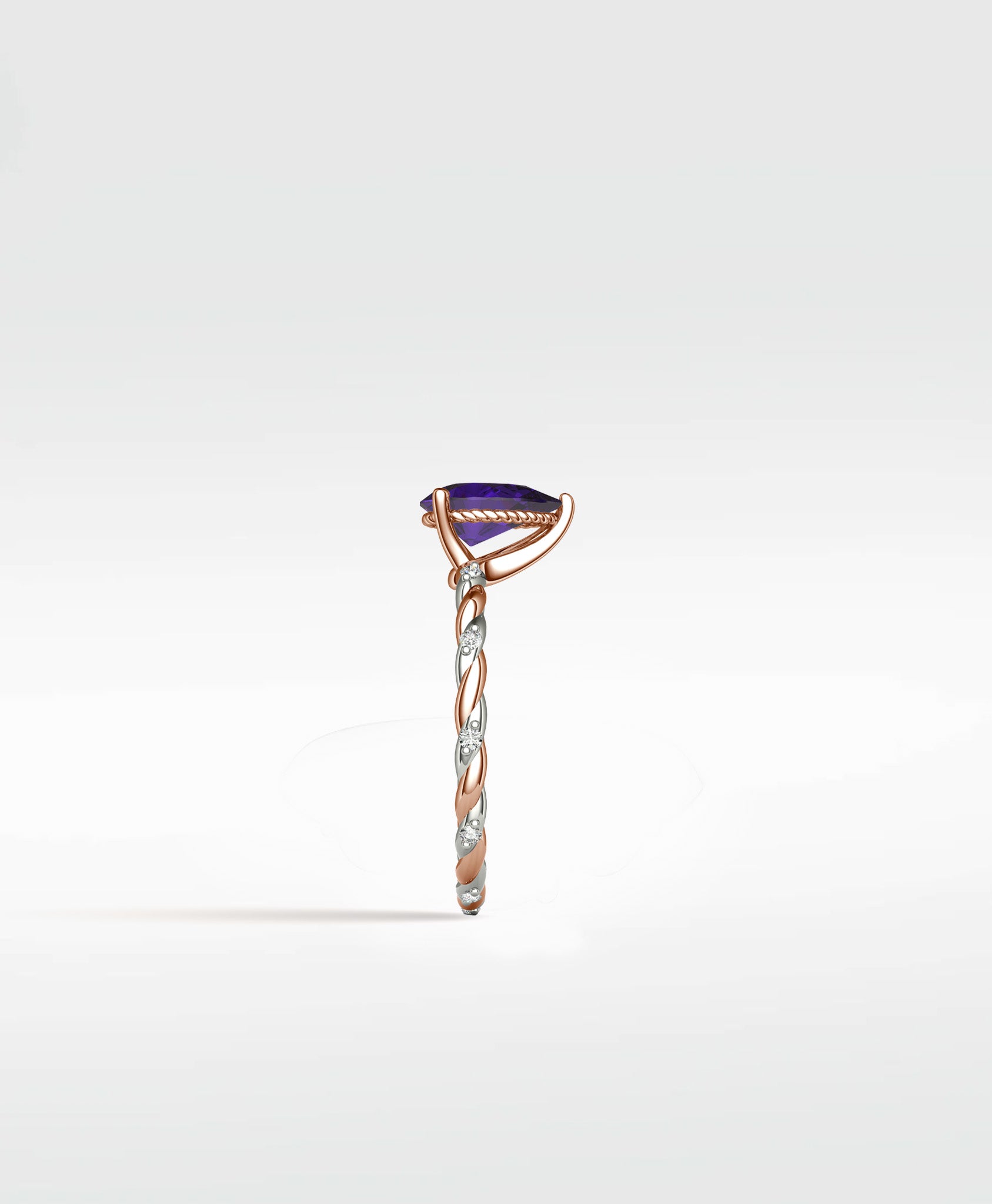 Side view of the Violet Elm Engagement Ring with a pear-shaped amethyst on a twisted two-tone rose gold and diamond pavé band.