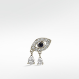 White gold evil eye earring with a sapphire pupil, diamond outline, and two dangling pear-shaped diamond drops.