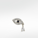Right option of an evil eye earring in 14k white gold, with a blue sapphire pupil, pavé diamonds, and a dangling pear diamond.