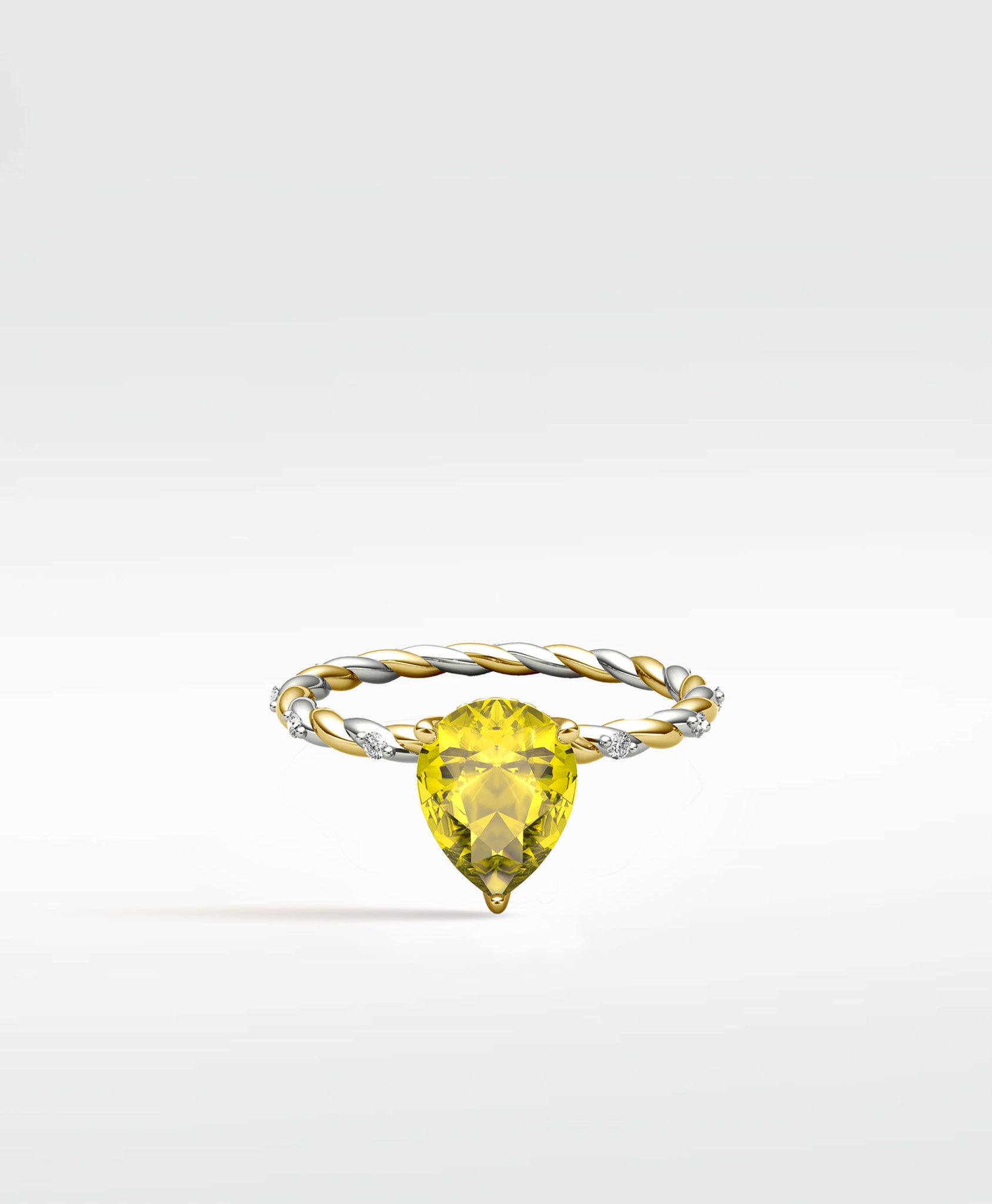 Canary Elm Engagement Ring with a pear-cut yellow gemstone on a twisted two-tone gold and diamond band.
