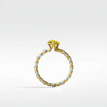 Canary Elm Engagement Ring featuring a yellow diamond on a twisted, two-tone band with pavé diamonds.