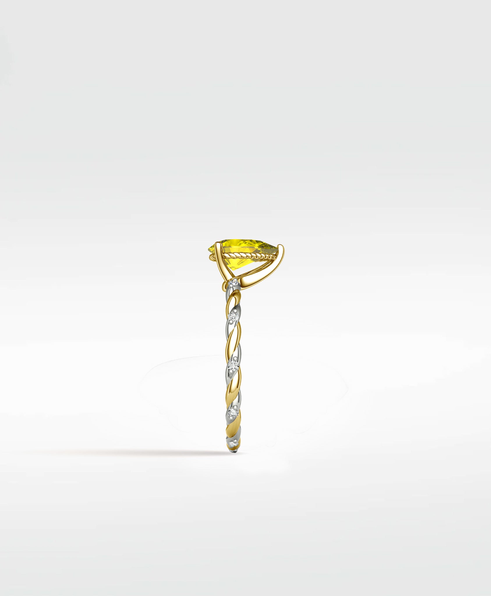 Side profile of the Canary Elm Engagement Ring with a pear-shaped yellow stone on a twisted two-tone gold and diamond band.