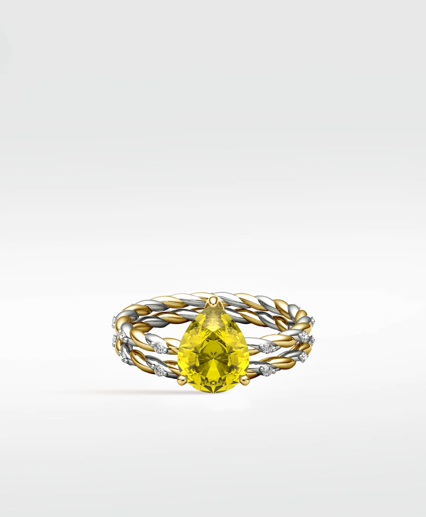 Canary Elm Engagement Ring with a pear-shaped yellow stone on a twisted gold and silver band with diamonds.