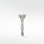 Side view of the Zamifolia Engagement Ring in platinum, featuring a twisted pavé diamond band and a brilliant cut center diamond.