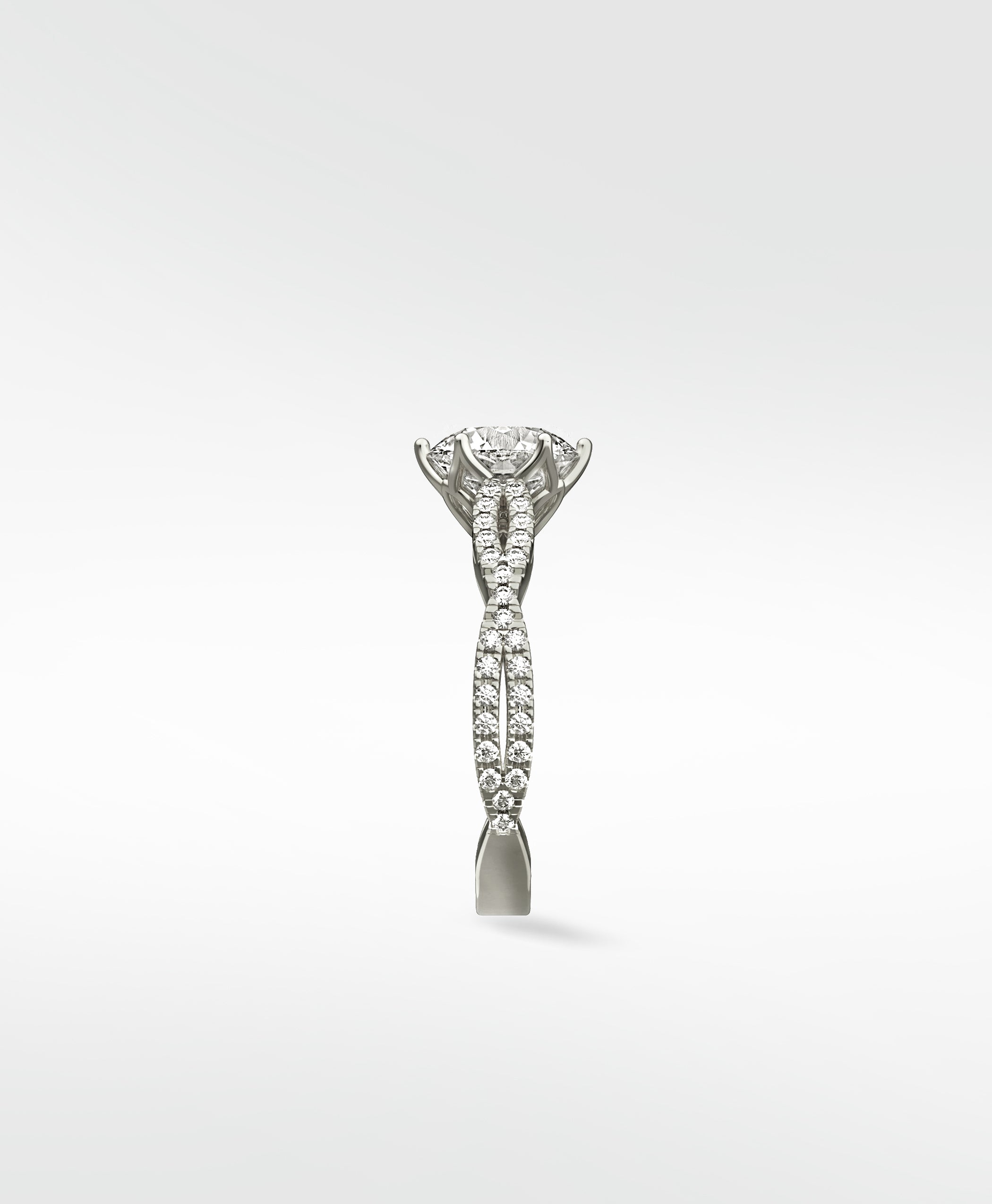 Side view of the Zamifolia Engagement Ring in platinum, featuring a twisted pavé diamond band and a brilliant cut center diamond.