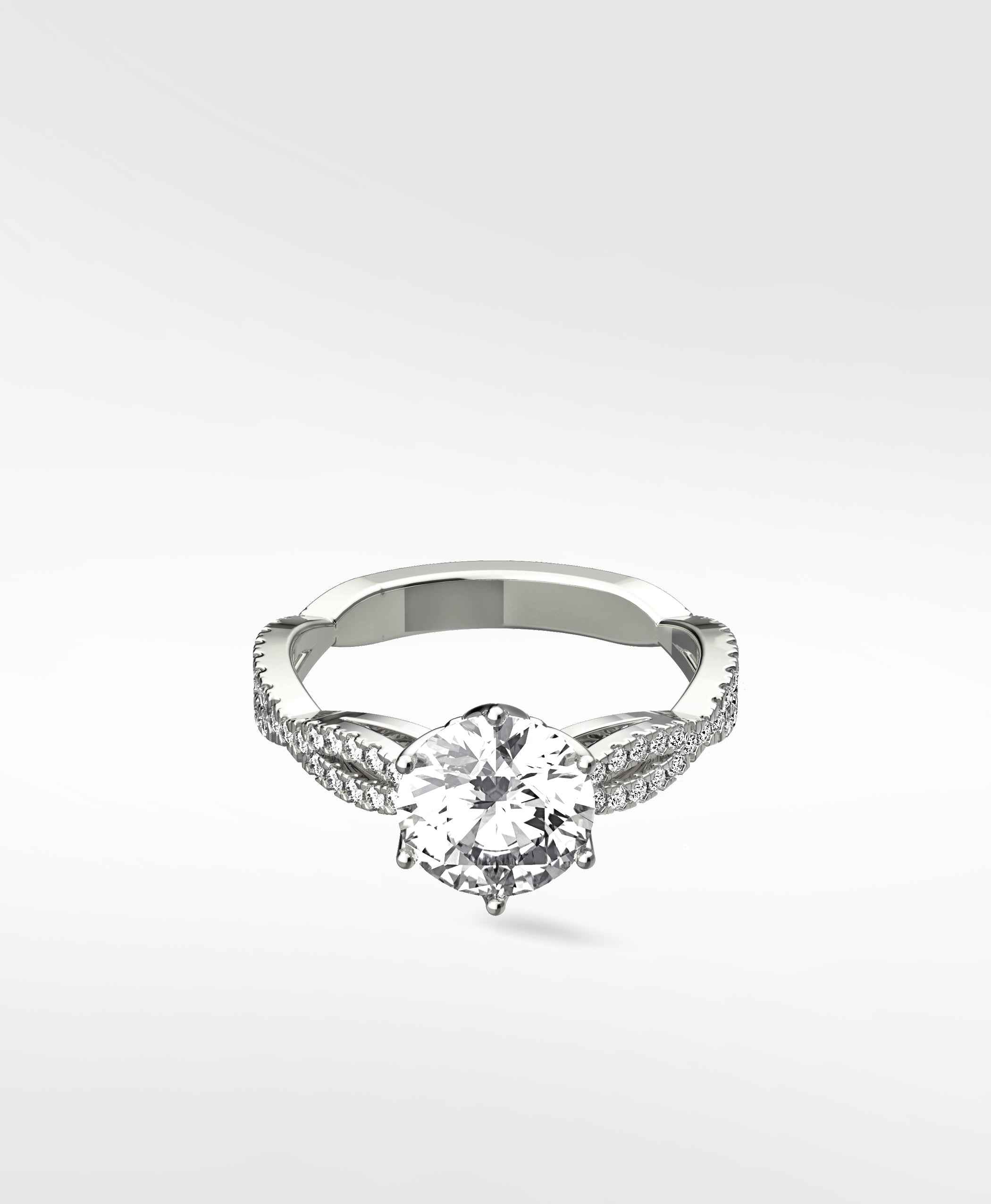 The Zamifolia platinum engagement ring with a round brilliant diamond and a pavé-set split shank band.