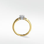 The Cacao Engagement Ring with an Asscher cut diamond, accent stones, and a yellow gold band in a two-tone style.
