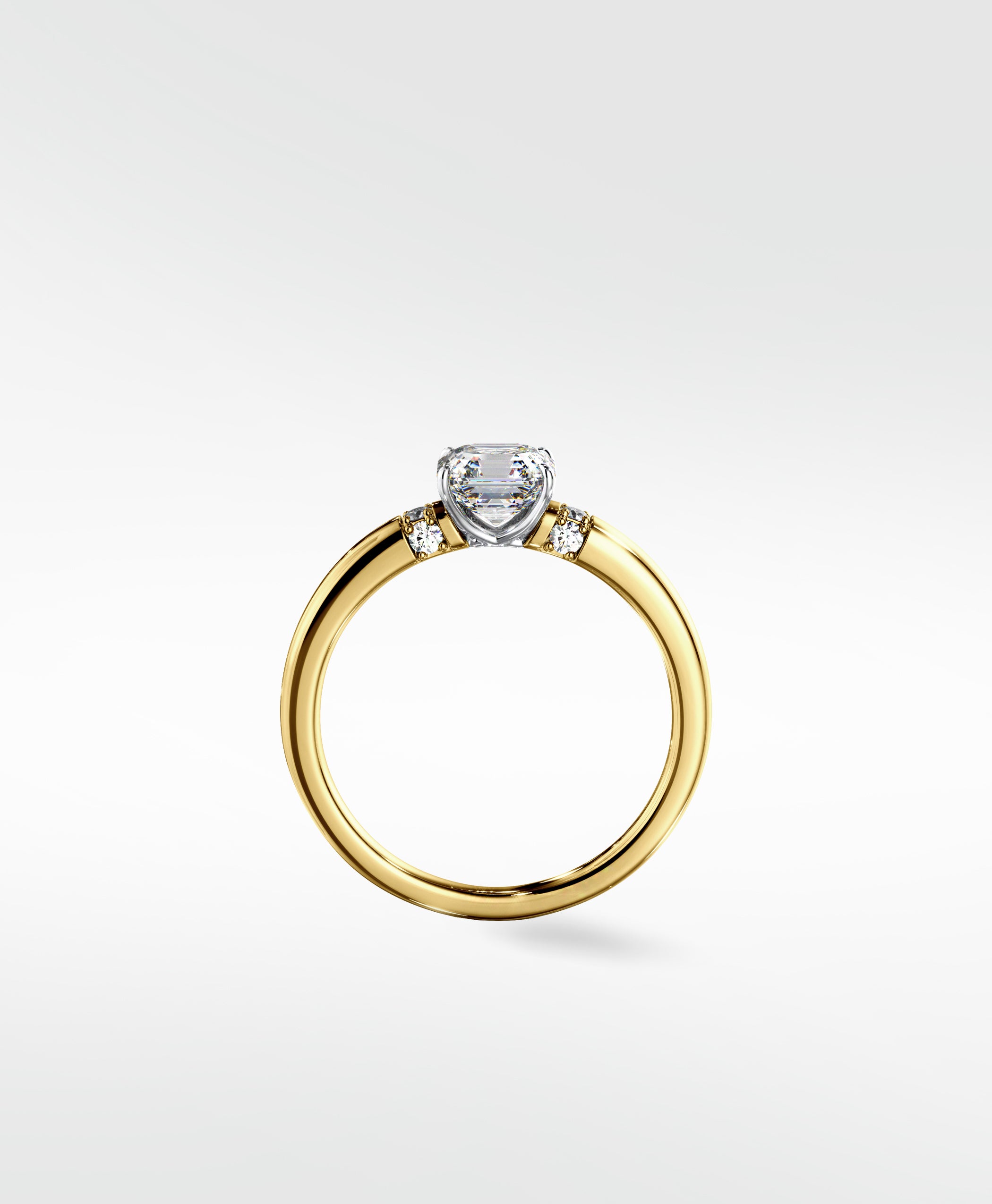 The Cacao Engagement Ring with an Asscher cut diamond, accent stones, and a yellow gold band in a two-tone style.