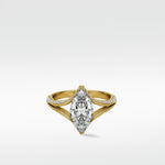 Lark & Berry's Chestnut Diamond Engagement Ring featuring a marquise-cut diamond on a yellow gold pavé split shank band.