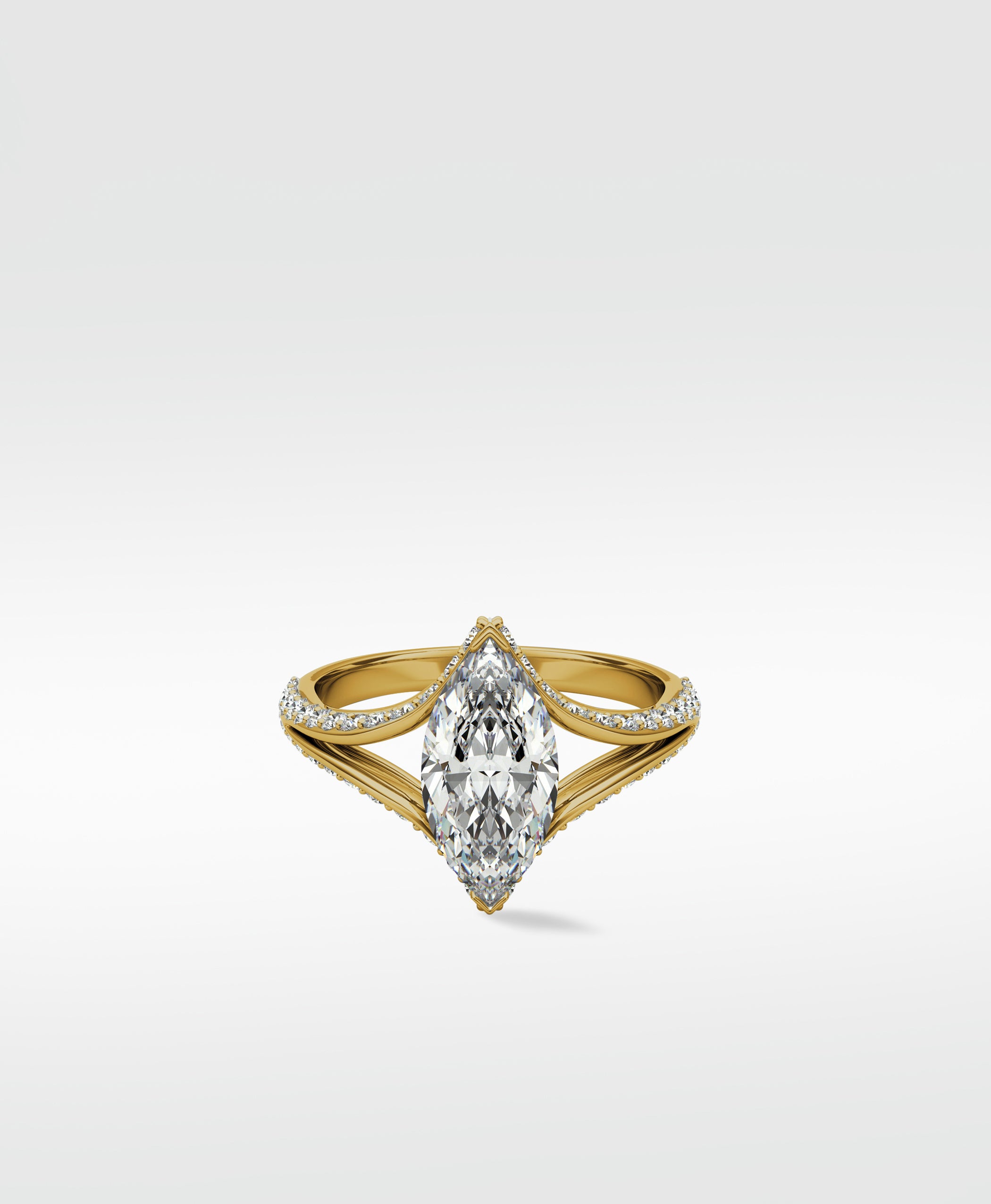 Lark & Berry's Chestnut Diamond Engagement Ring featuring a marquise-cut diamond on a yellow gold pavé split shank band.
