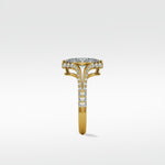 Side profile of the Chestnut Diamond Engagement Ring with a pave diamond split shank gold band and halo setting.