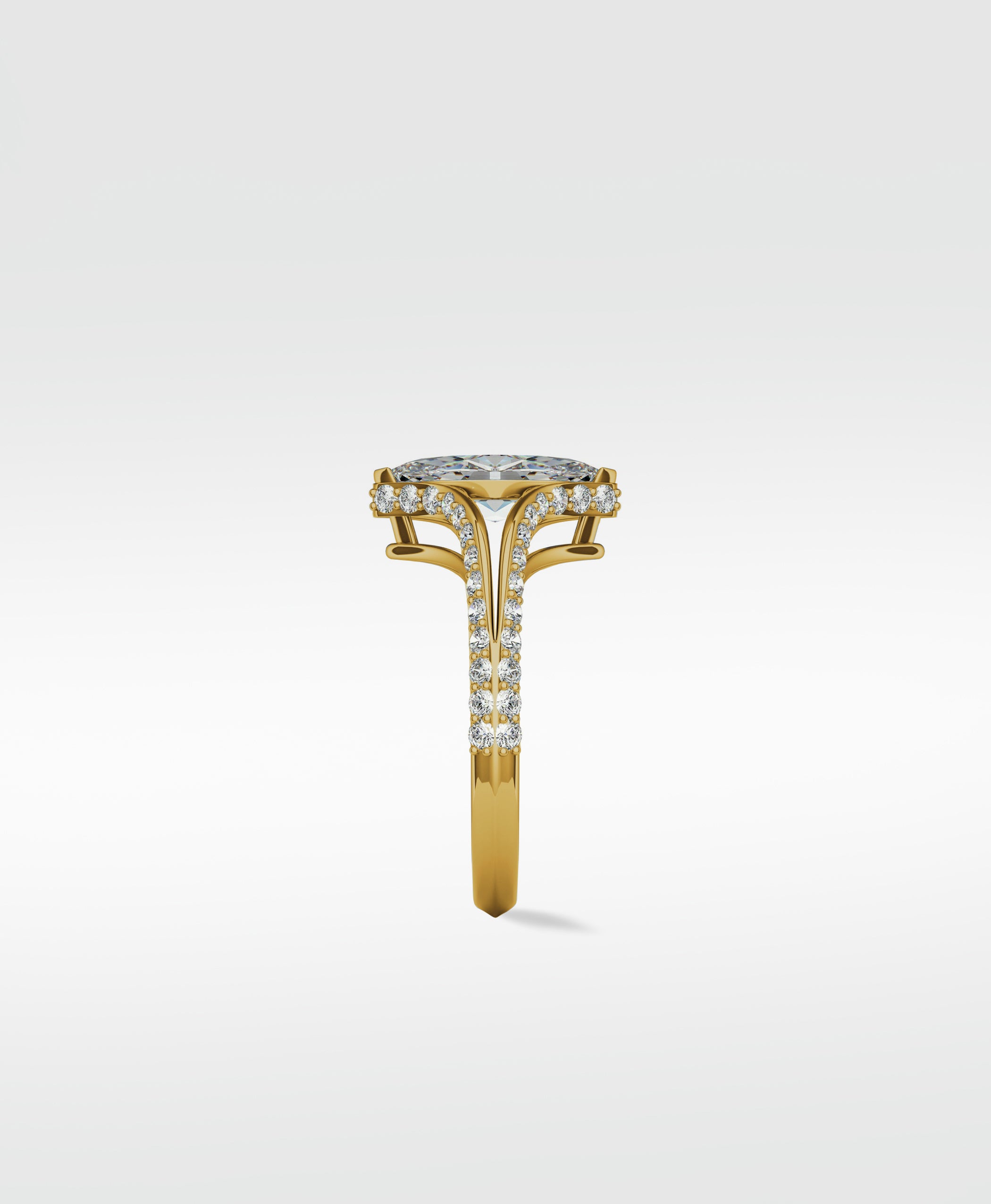 Side profile of the Chestnut Diamond Engagement Ring with a pave diamond split shank gold band and halo setting.