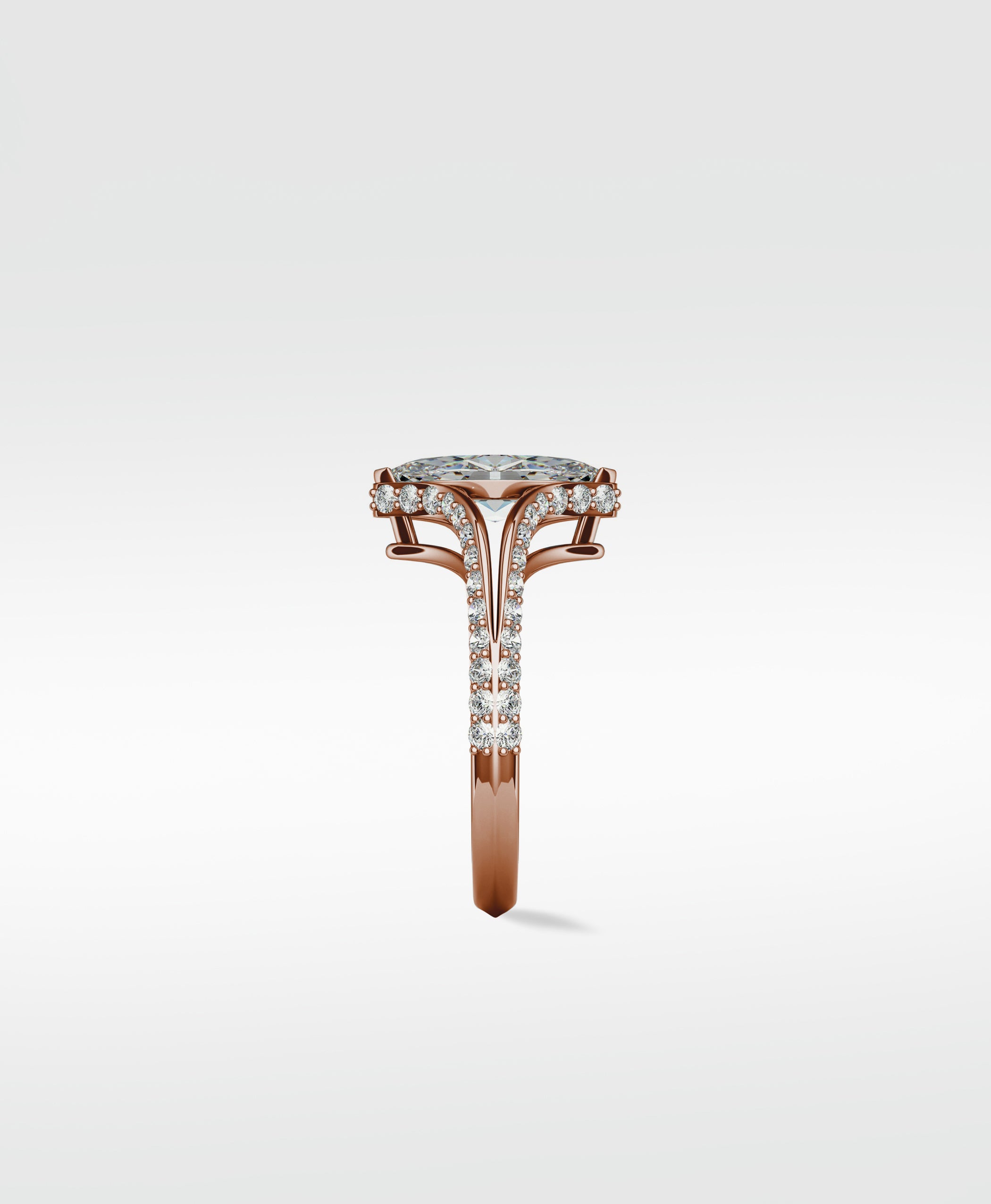 A detailed side view of the rose gold Chestnut Diamond Engagement Ring, featuring a pavé split shank and diamond halo.