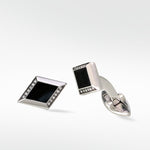 Polished silver Clarke Cufflinks in a diamond shape with a black inlay and pavé diamond details.