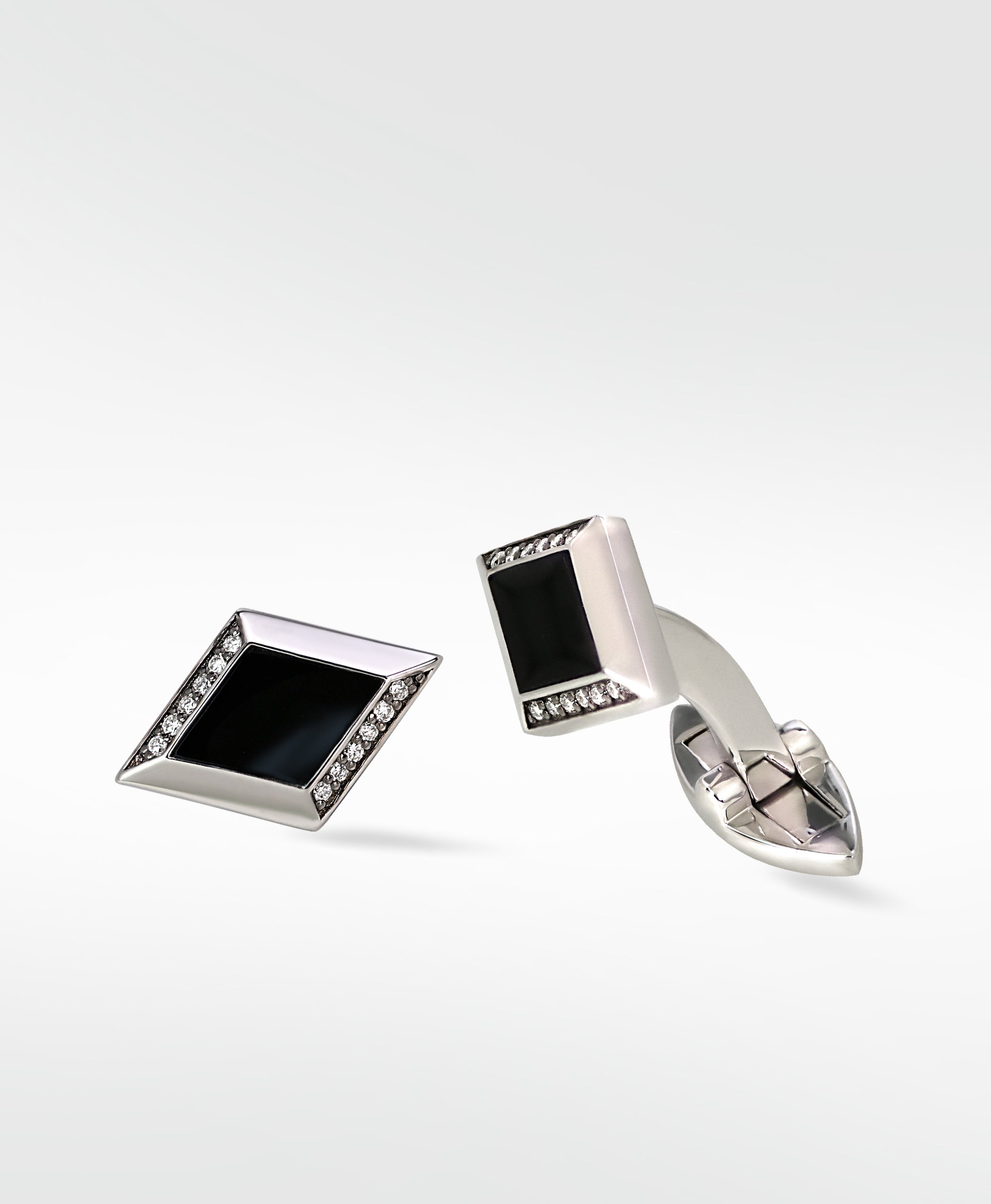 Polished silver Clarke Cufflinks in a diamond shape with a black inlay and pavé diamond details.