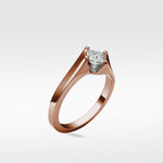 The Elder Engagement Ring in polished rose gold, featuring a princess cut diamond in a modern, clean-lined setting.