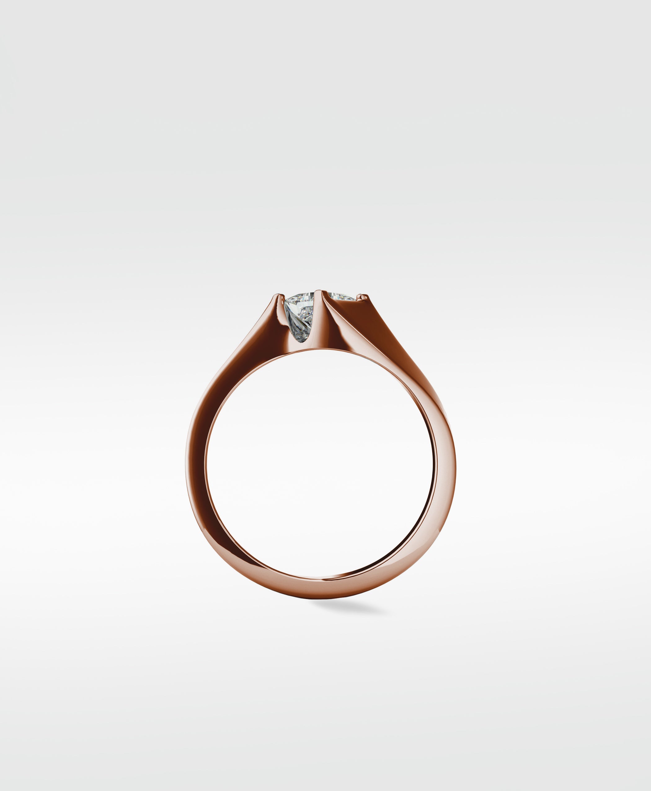 Side profile of the Elder Engagement Ring in rose gold, featuring a princess cut diamond in a modern tension setting.
