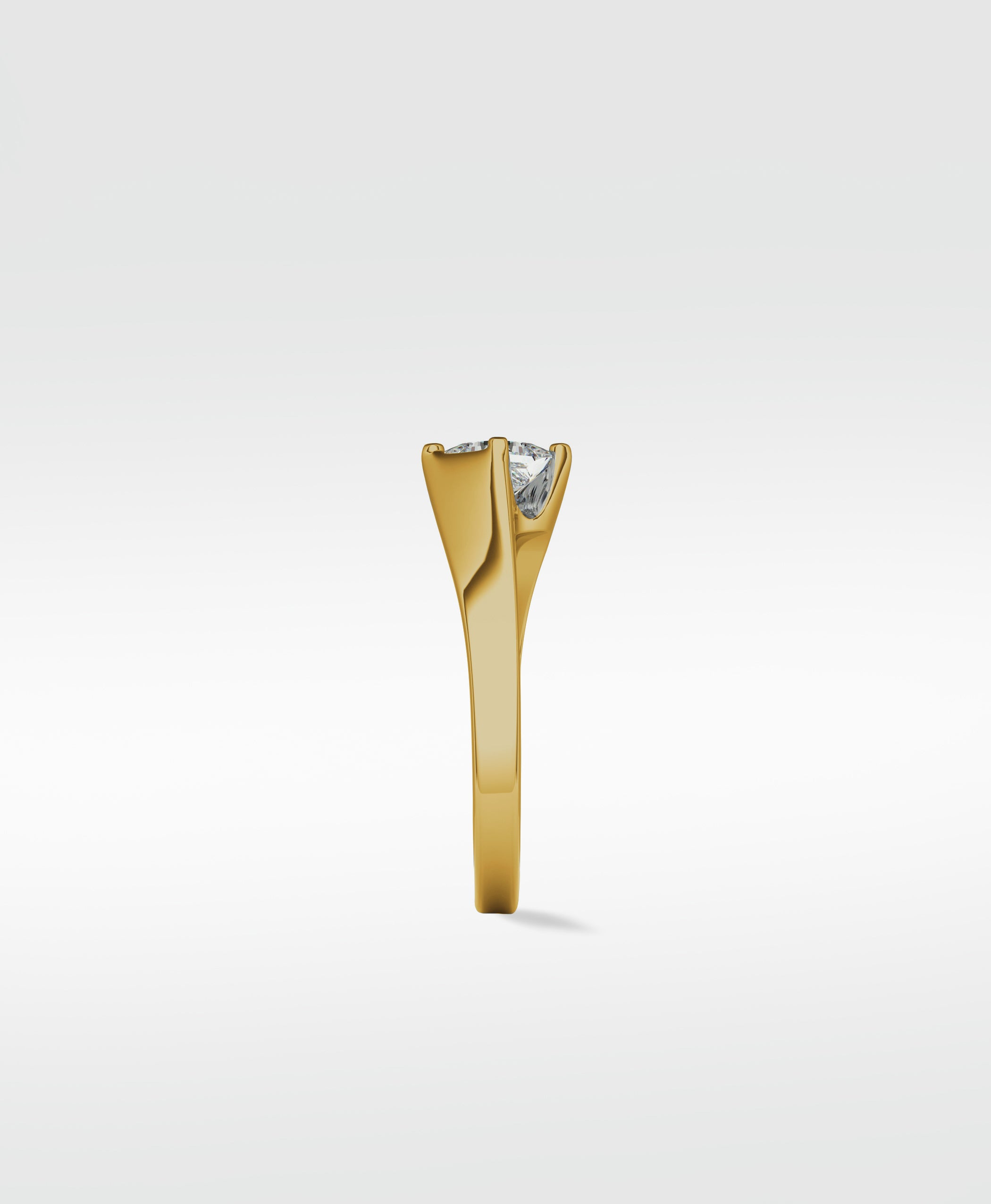Side view of the Elder Engagement Ring in yellow gold, featuring a princess cut diamond in a modern, clean-lined setting.