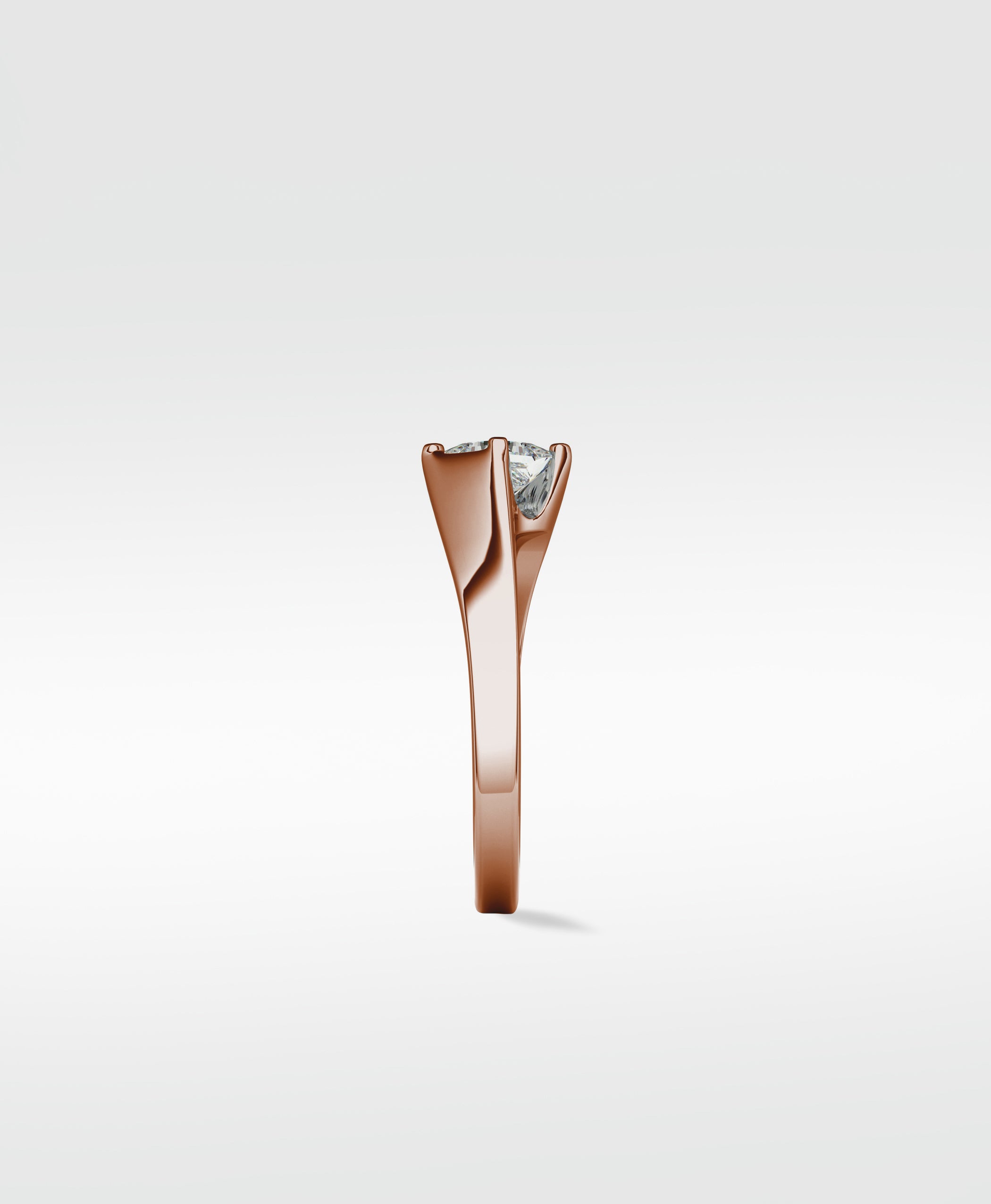 Side view of the Elder Engagement Ring in rose gold, showcasing its sculpted band and a brilliant princess cut diamond.