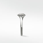 Side profile of the platinum Vine Diamond Engagement Ring, showcasing its unique vine-inspired setting holding a round diamond.
