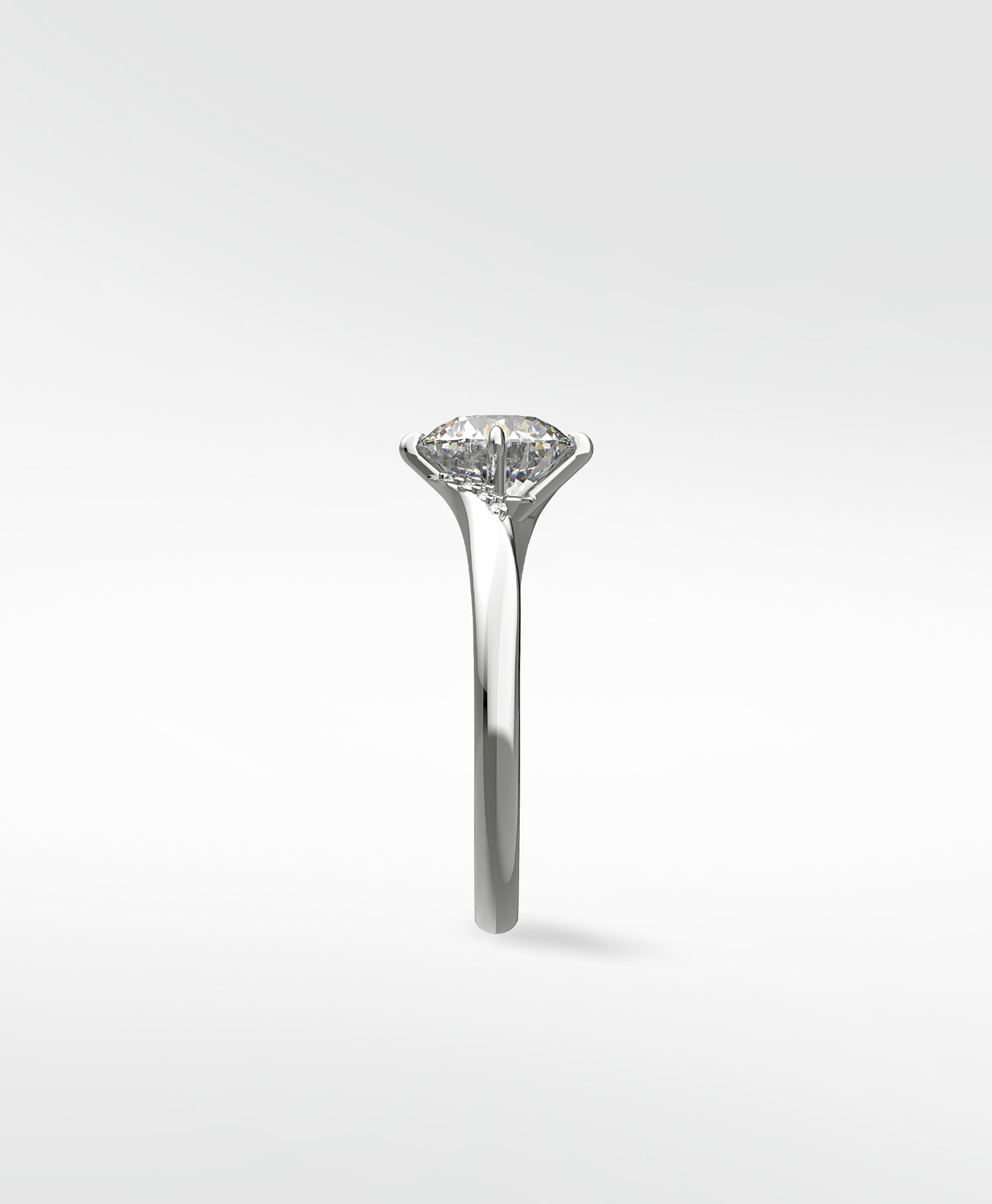 Side profile of the platinum Vine Diamond Engagement Ring, showcasing its unique vine-inspired setting holding a round diamond.