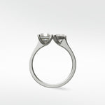 Side profile of the Wisteria Toi et Moi engagement ring with two cushion-cut diamonds set in platinum.