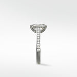 Side profile of the Wisteria Diamond Engagement Ring in platinum, showing the pavé diamond band and basket setting.