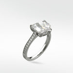 Wisteria Toi et Moi diamond engagement ring in platinum, featuring a rectangular and a pear-cut diamond on a pavé band.