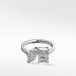 Platinum Wisteria Toi et Moi engagement ring with a marquise and radiant cut diamond on a pavé band.