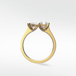 Side profile of the Wisteria Toi et Moi engagement ring in yellow gold, showing its two heart-shaped diamond setting.