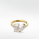 Wisteria Toi et Moi engagement ring in yellow gold with a radiant and a marquise cut diamond on a pavé band.