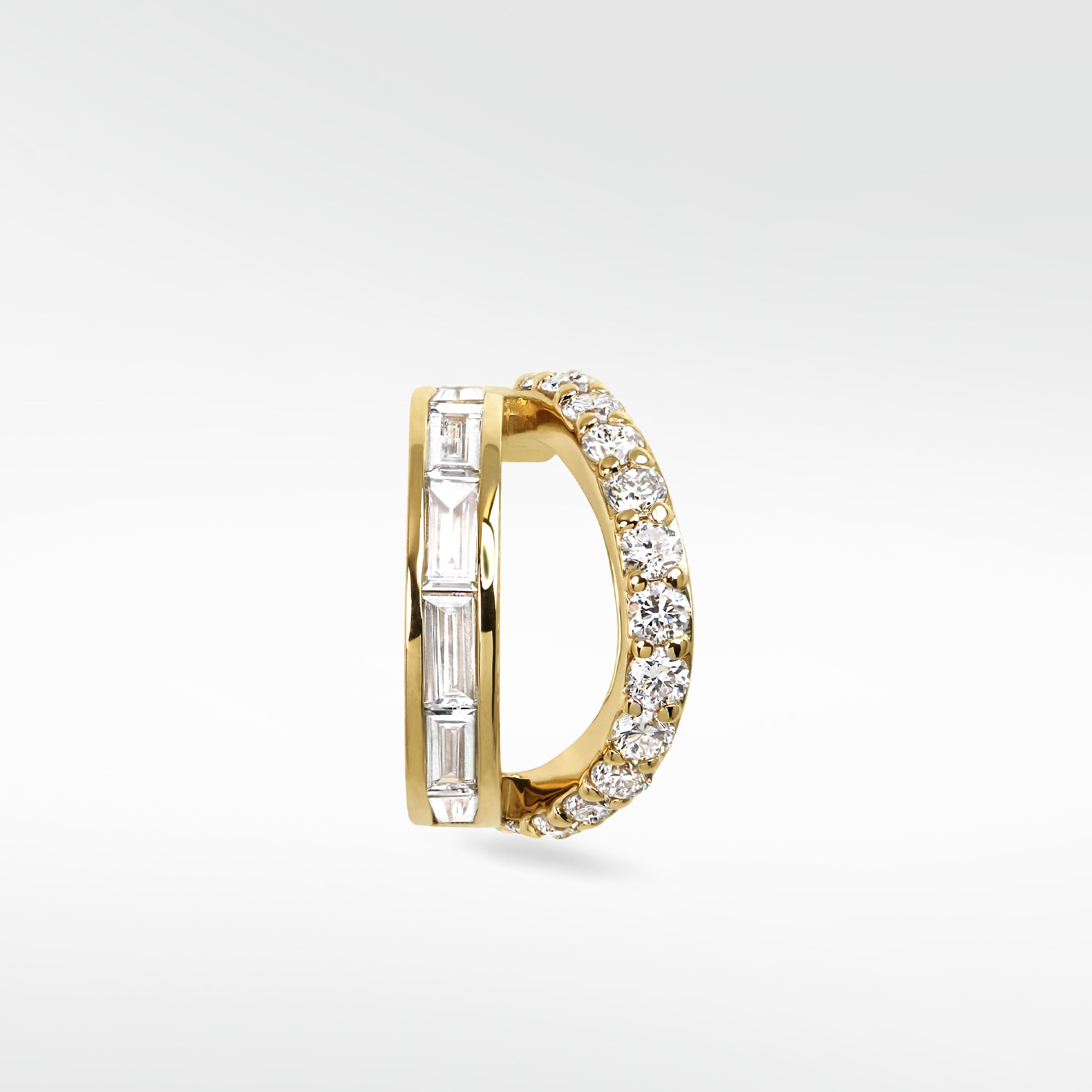 Modernist Double Diamond Hoop earring in yellow gold, featuring contrasting rows of baguette and brilliant-cut diamonds.