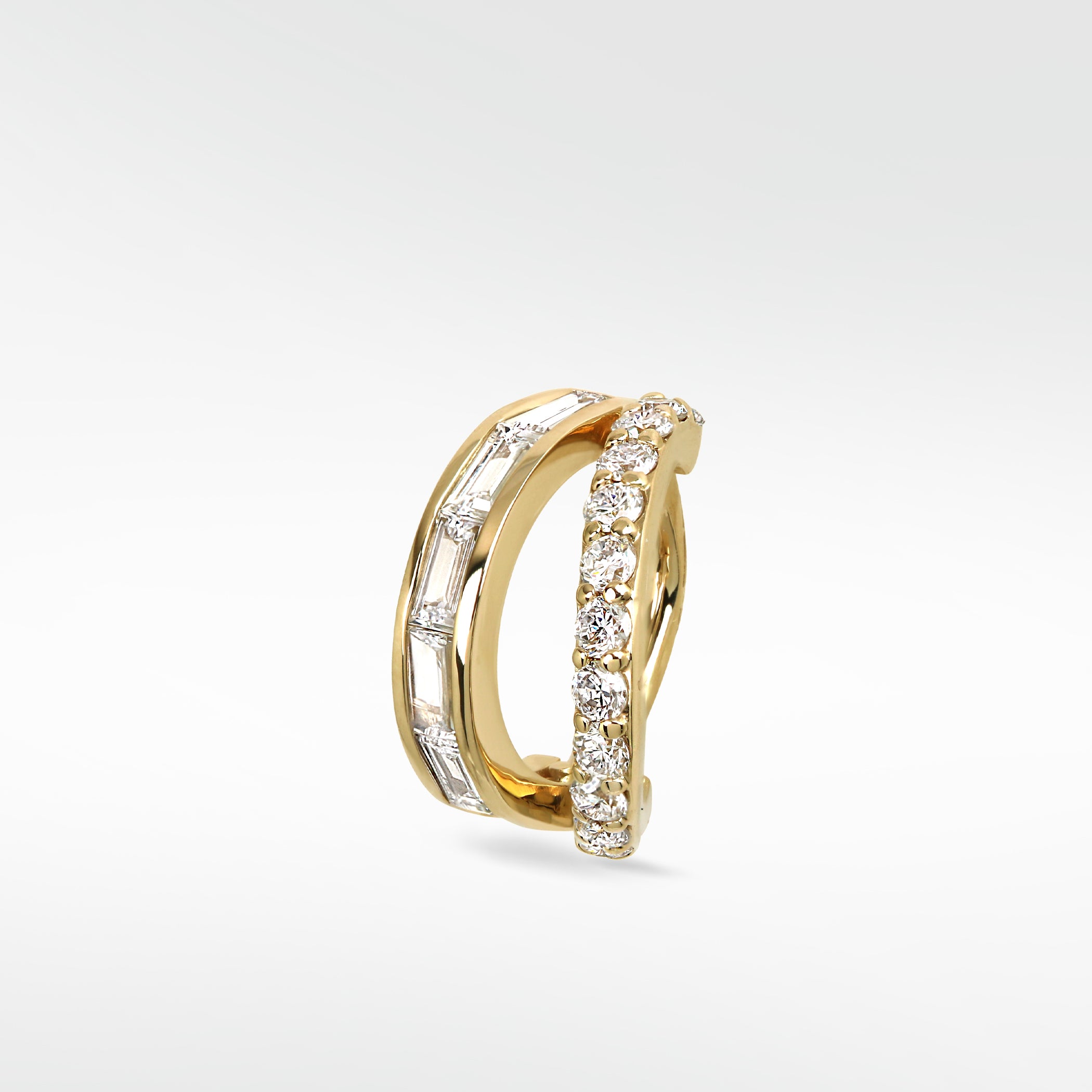 Close-up of the Modernist Double Diamond Hoop with parallel bands of baguette and round diamonds set in polished yellow gold.