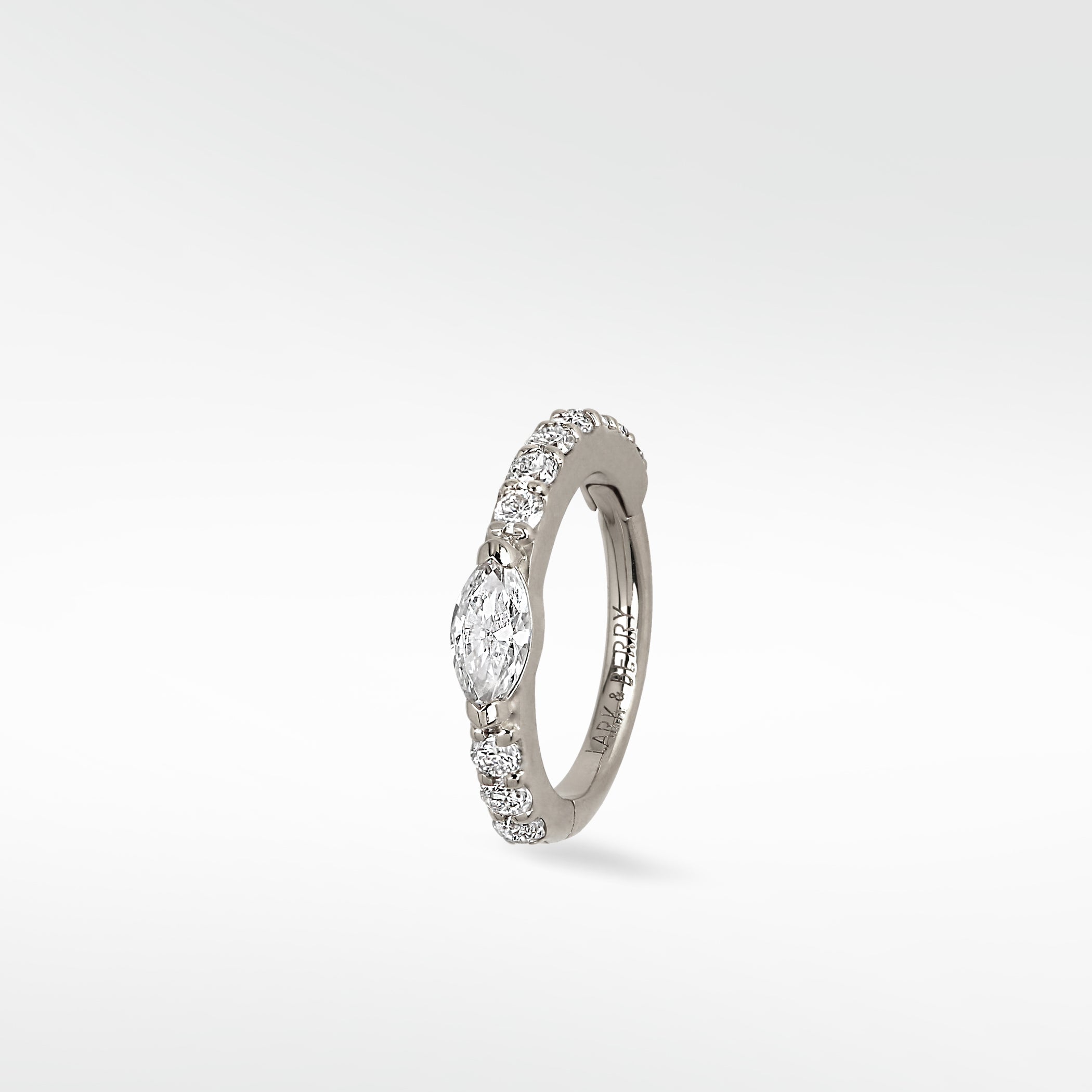A Modernist Marquise Pave Hoop in white gold with a central marquise diamond and surrounding pavé stones.