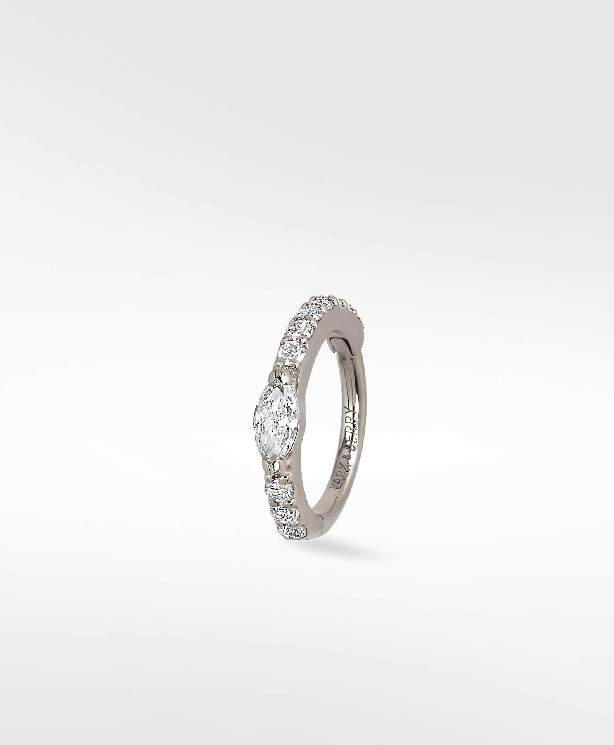 A Modernist Marquise Pave Hoop in white gold with a central marquise diamond and surrounding pavé stones.