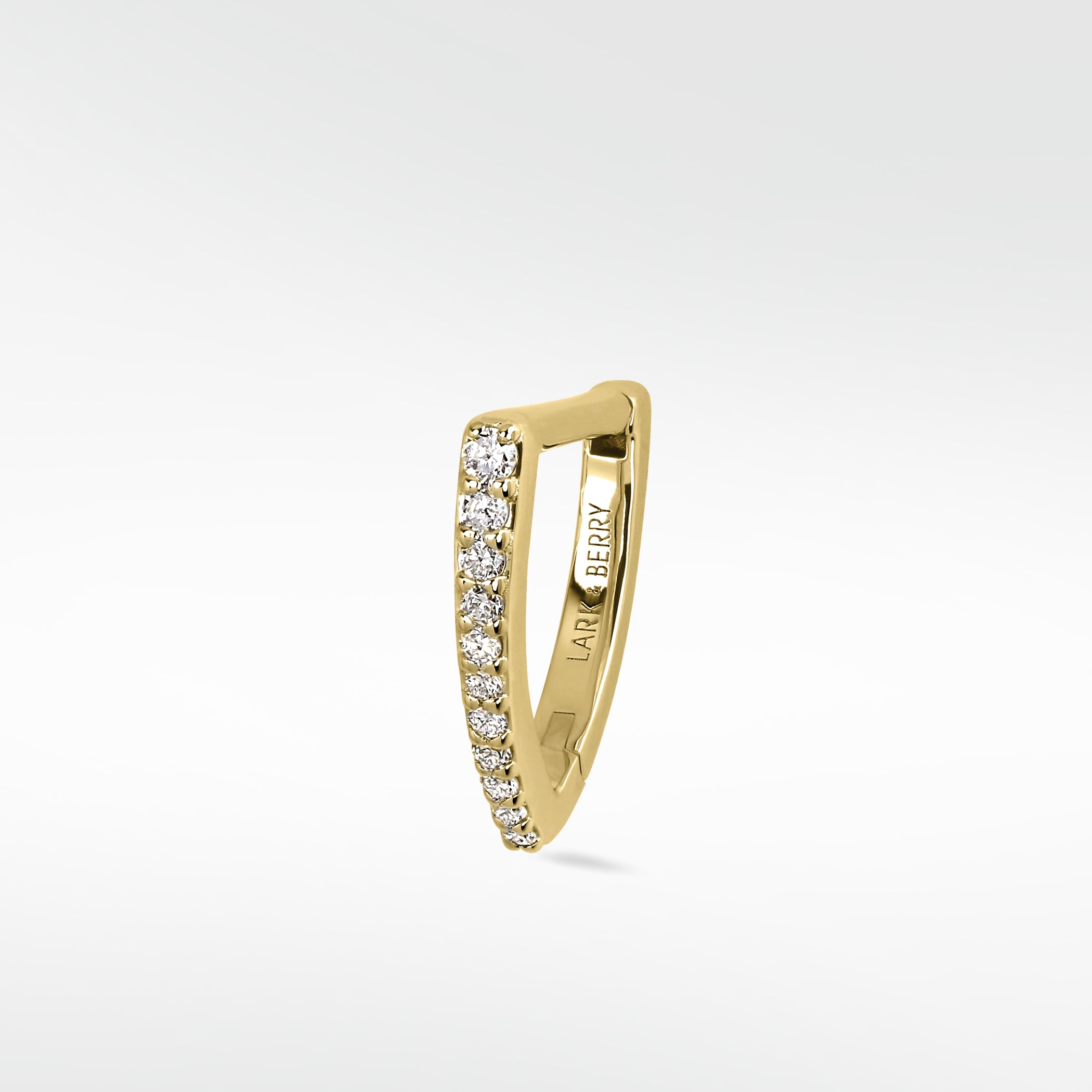 Lark & Berry Modernist Graduating Pave Hoop in 14k gold, a pointed earring with a row of pave diamonds.