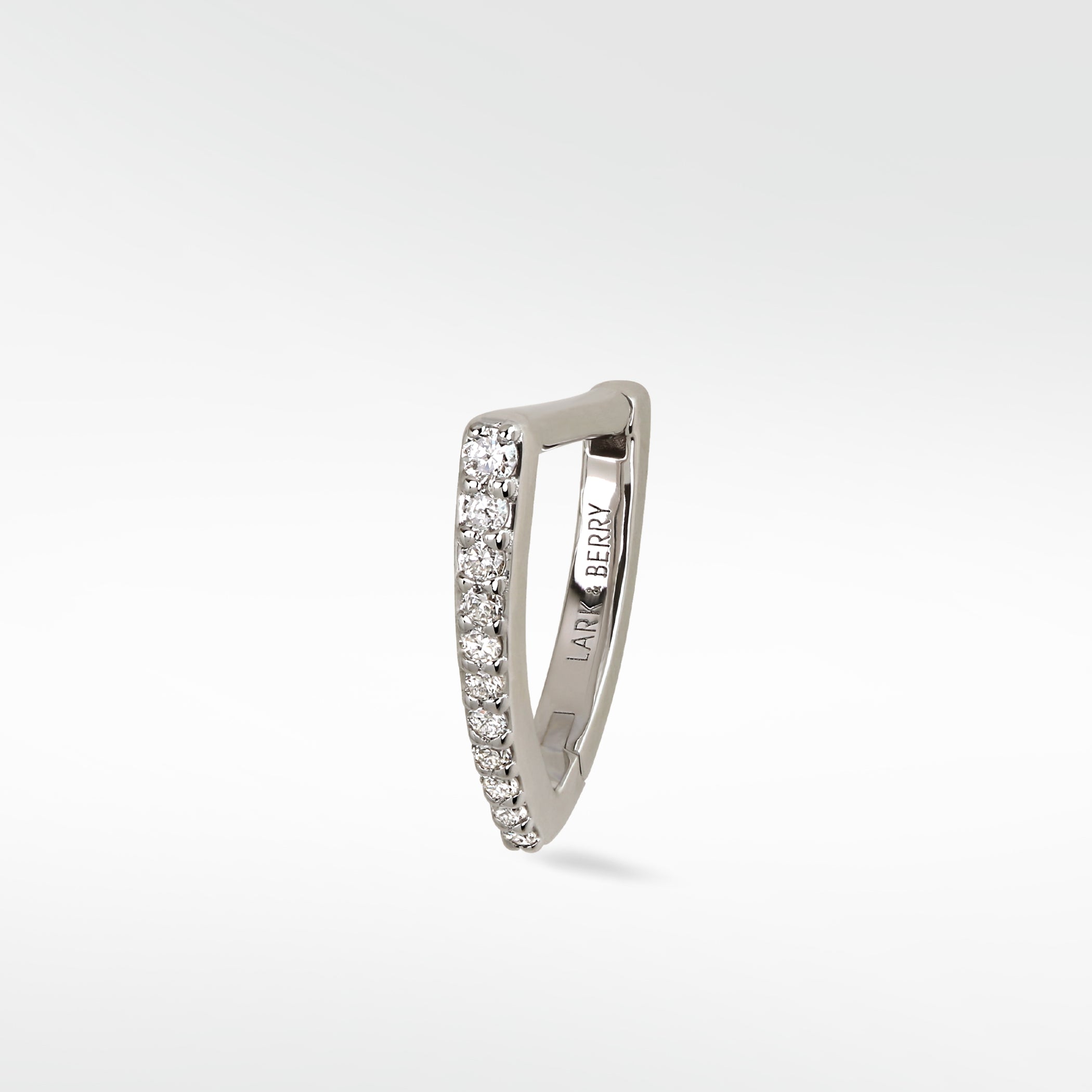 Lark & Berry Modernist V-shaped hoop earring in white gold, featuring a line of graduating pavé diamonds.