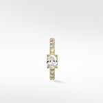 Front view of the Modernist Oval Diamond Hoop with a central oval diamond and a pavé diamond band set in yellow gold.