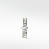 A white gold Modernist hoop earring with a central triangle diamond and baguette diamond accents, on a white background.