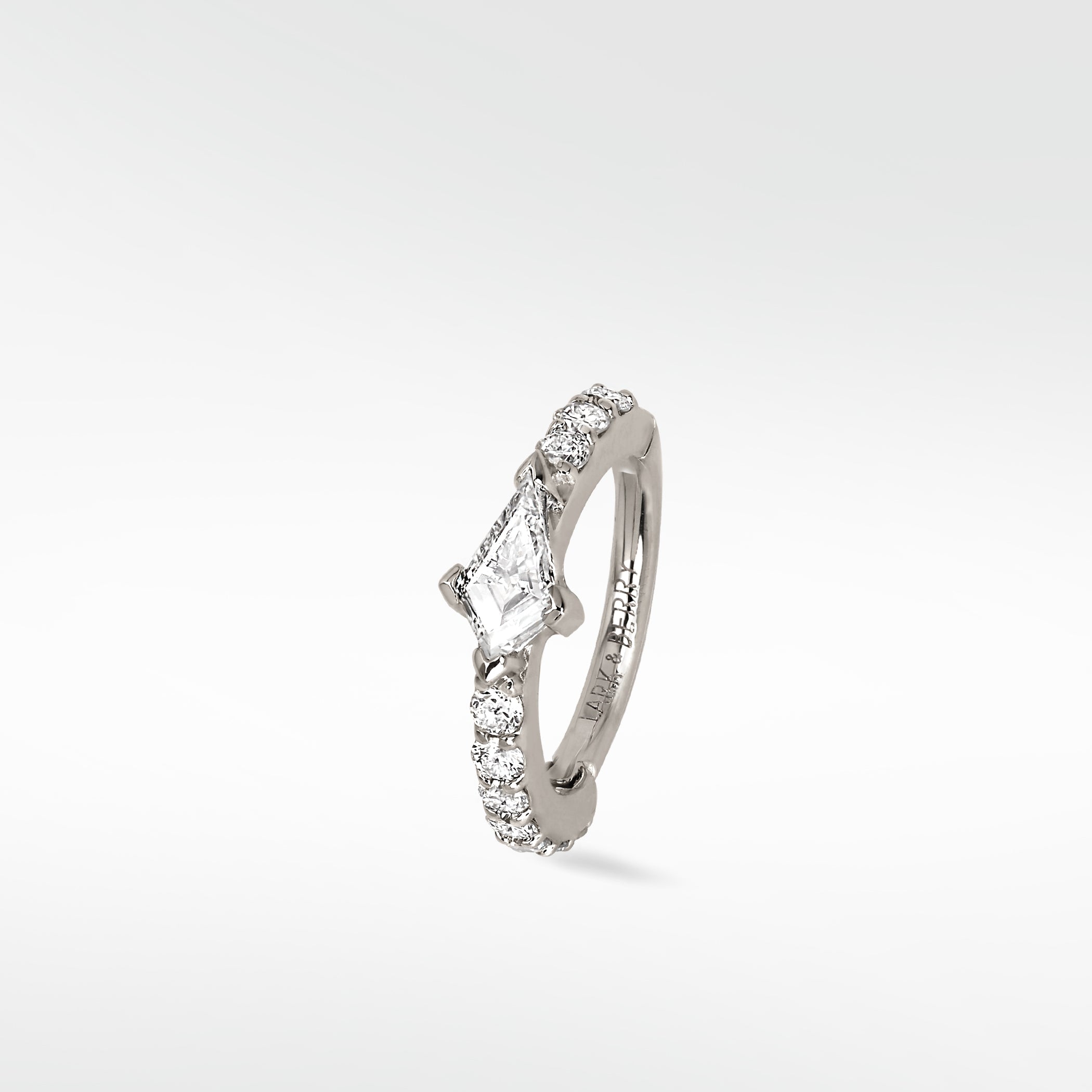 Modernist Kite Diamond Hoop earring in 14k white gold with a central kite-cut diamond and brilliant cut pavé diamonds.