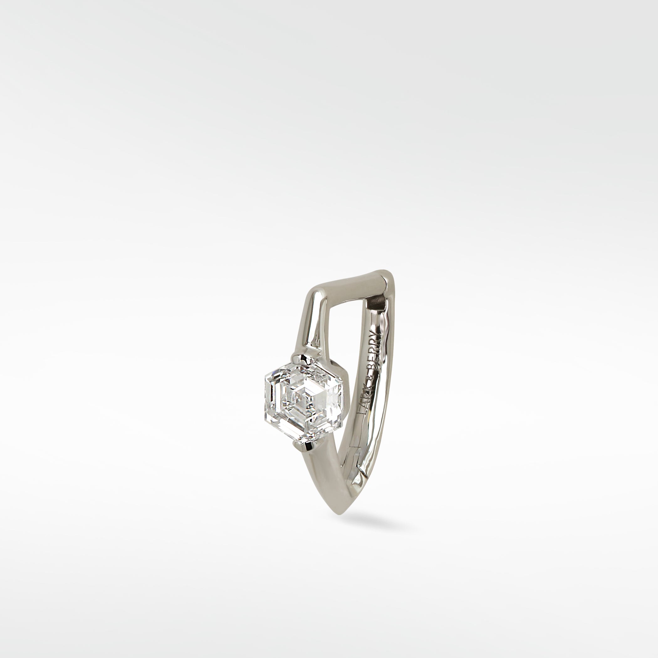 Lark & Berry Modernist hoop earring in 14k white gold with a hexagonal diamond on a knife-edged band.