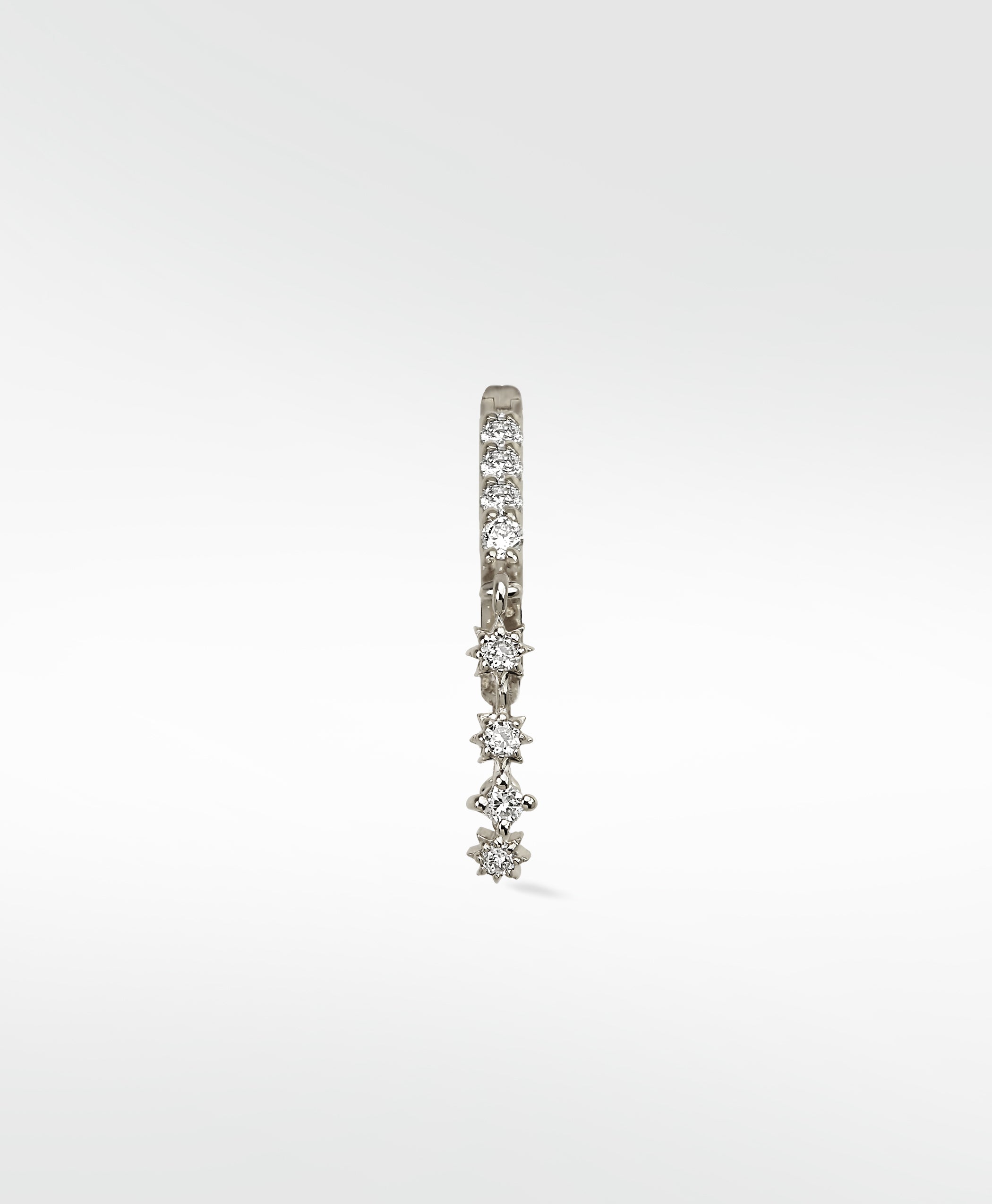 A single Modernist Celestial Drop Hoop earring in white gold, with a dangling drop of four star-set diamonds.