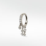 A single Modernist Celestial Drop Hoop earring in white gold, with pavé diamonds on the hoop and dangling diamond star charms.