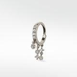 A single Modernist Celestial Drop Hoop earring in white gold, with pavé diamonds on the hoop and dangling diamond star charms.