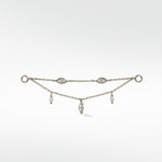 Lark & Berry's Double Diamond Drop Chain in white gold, with two chains featuring bezel-set and dangling marquise diamonds.