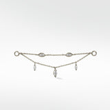 Lark & Berry's Double Diamond Drop Chain in white gold, with two chains featuring bezel-set and dangling marquise diamonds.