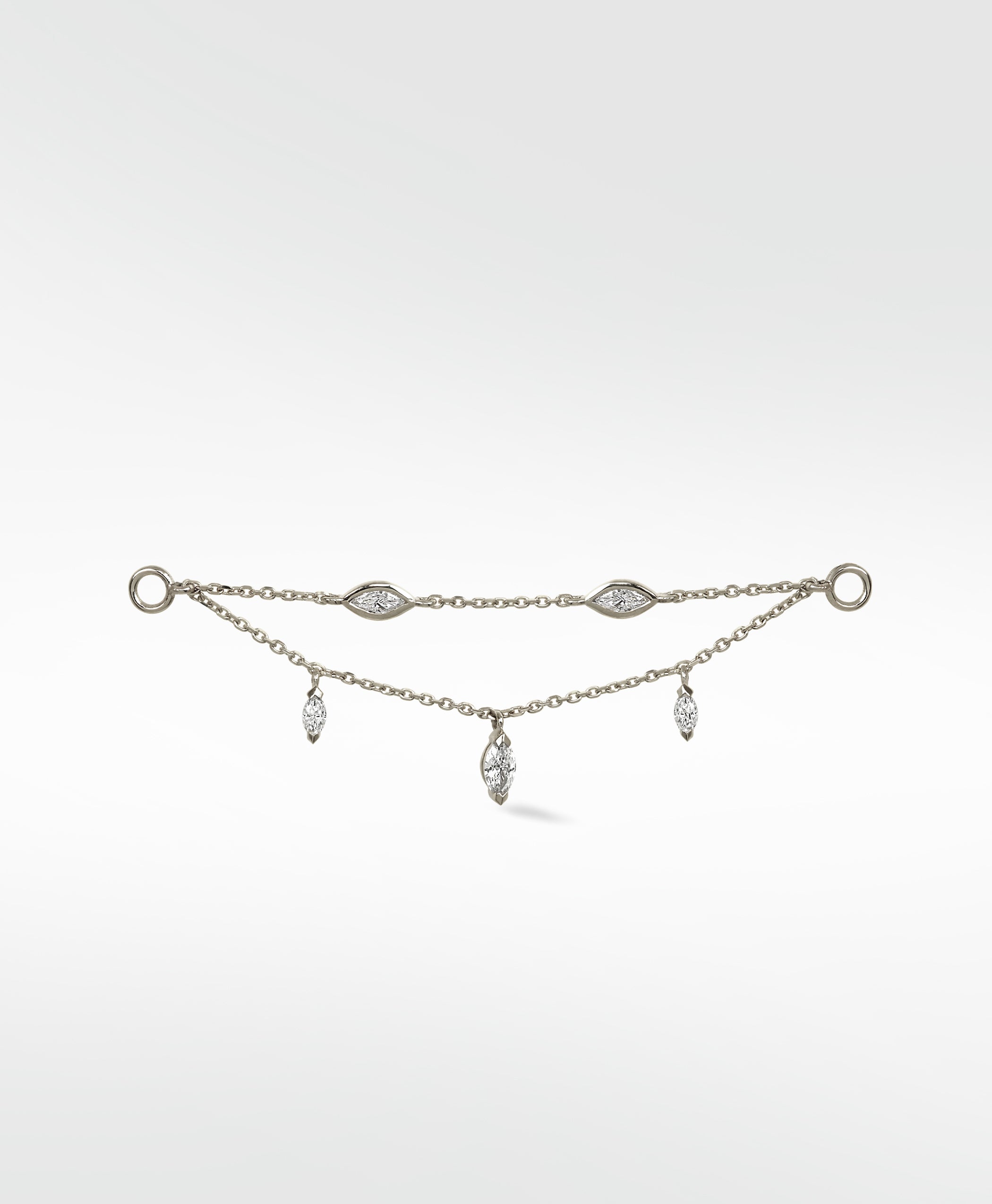 Lark & Berry's Double Diamond Drop Chain in white gold, with two chains featuring bezel-set and dangling marquise diamonds.