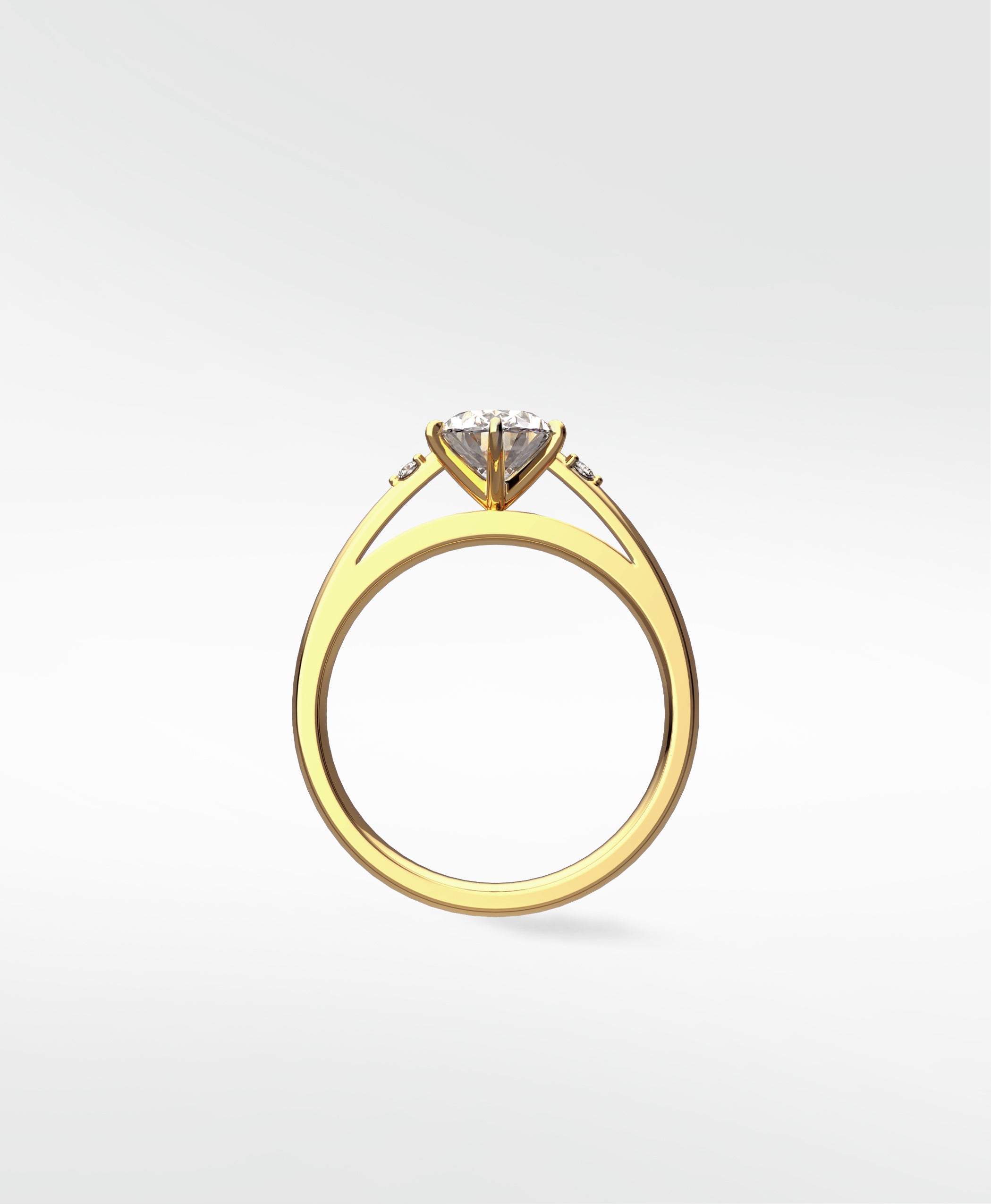 Profile view of the Kentia Engagement Ring in yellow gold, featuring a round center diamond and accent stones on a split shank.