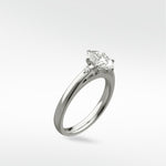 Kentia Engagement Ring in white gold with a marquise-cut diamond and accent stones, shown at a three-quarter angle.