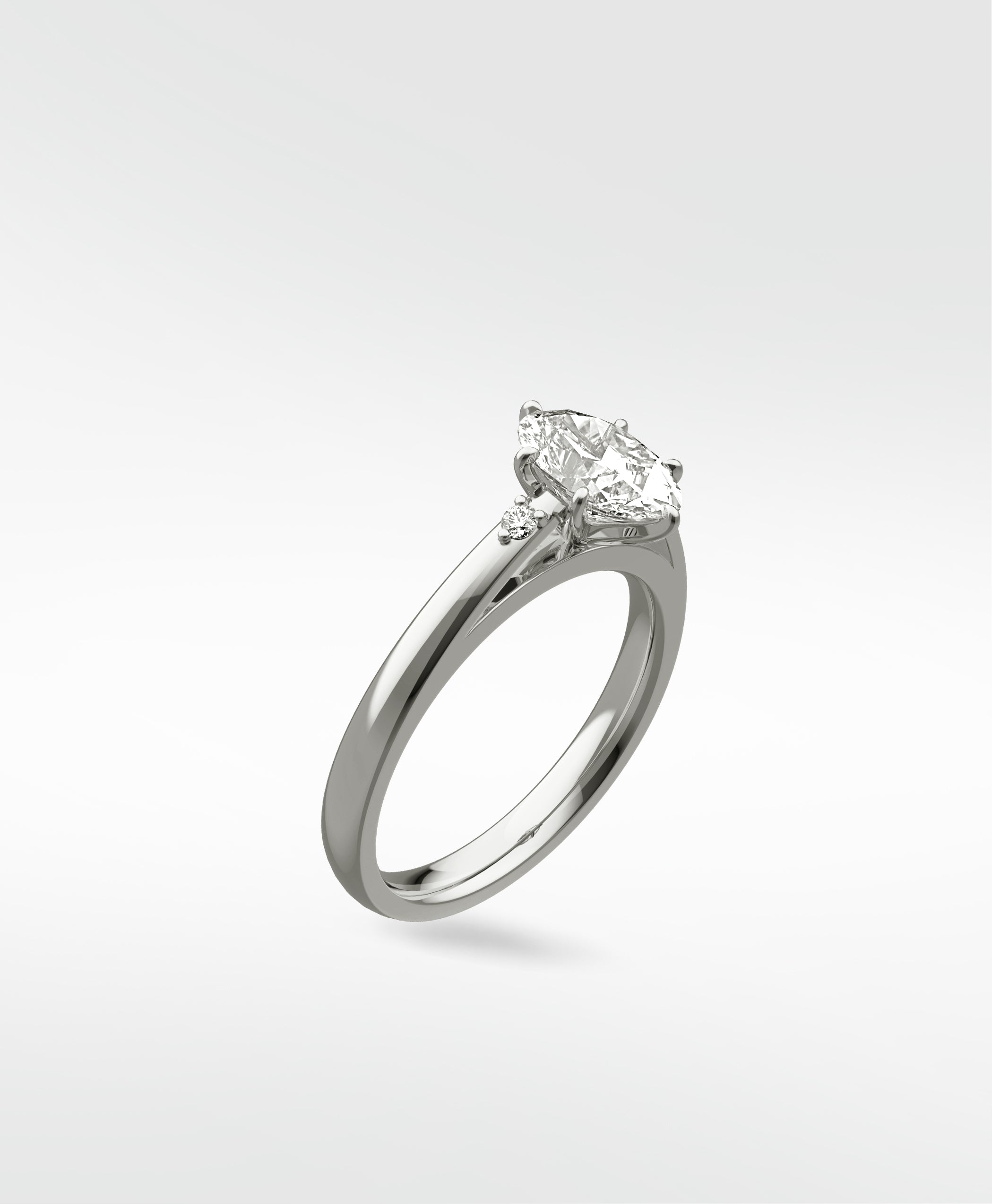 Kentia Engagement Ring in white gold with a marquise-cut diamond and accent stones, shown at a three-quarter angle.